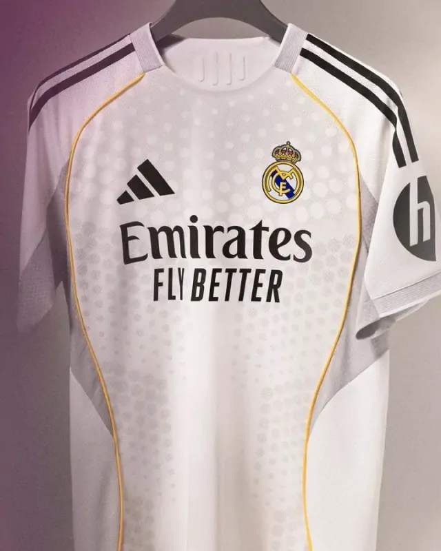 The official 2025-26 Real Madrid home soccer jersey in white and gold.