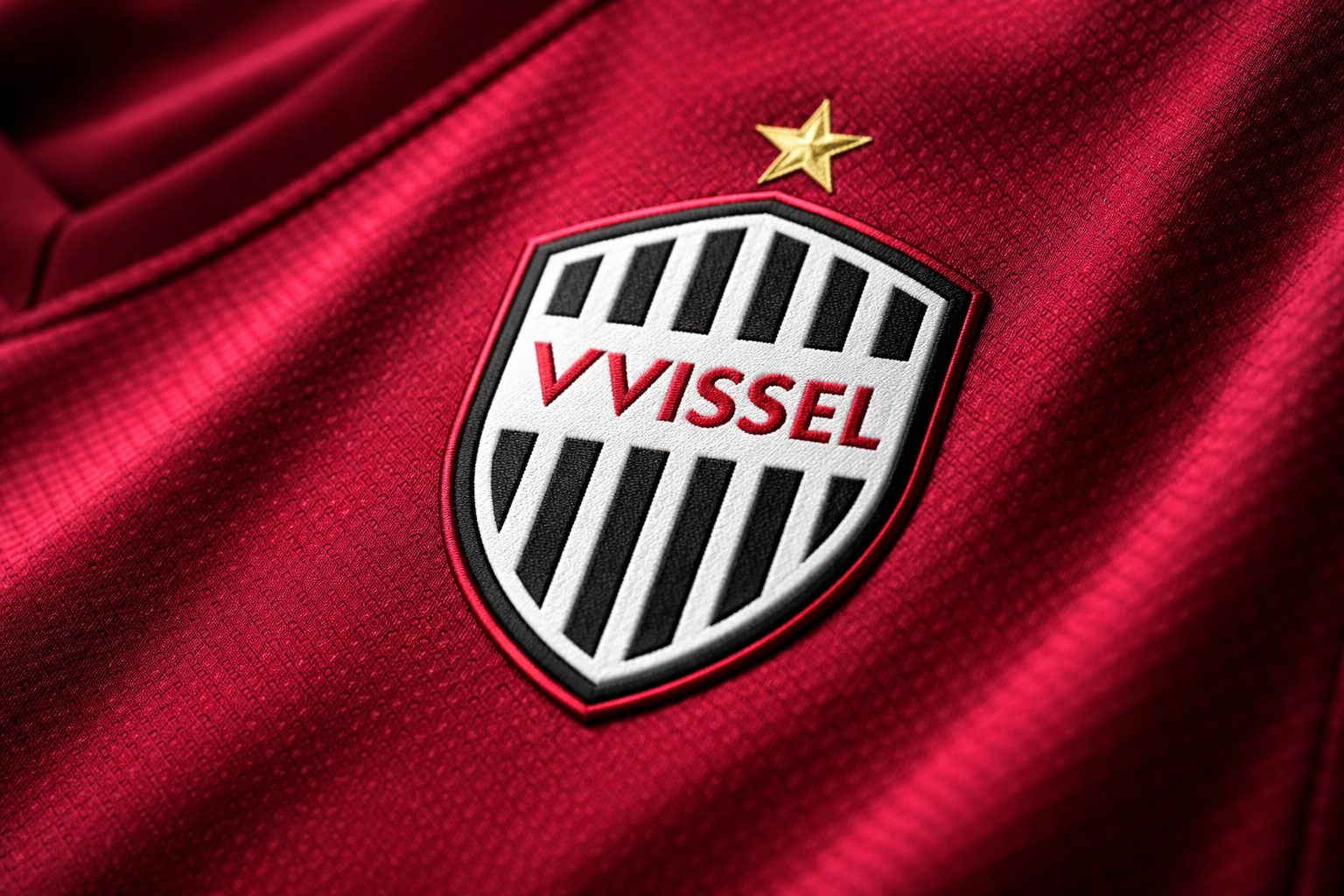 Close-up detail of Vissel Kobe jersey crest and fabric
