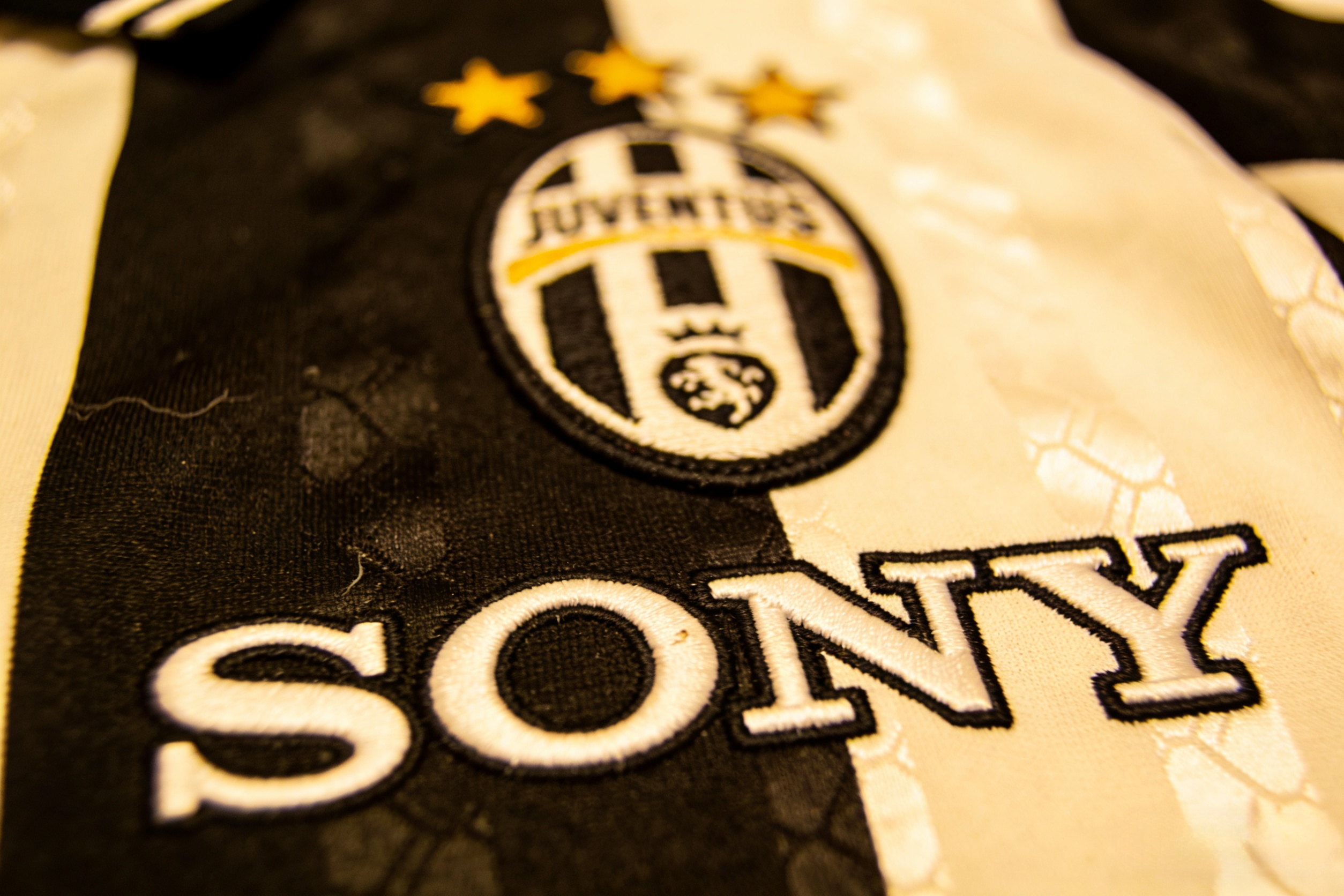 Close-up detail of a retro Juventus shirt with Sony logo