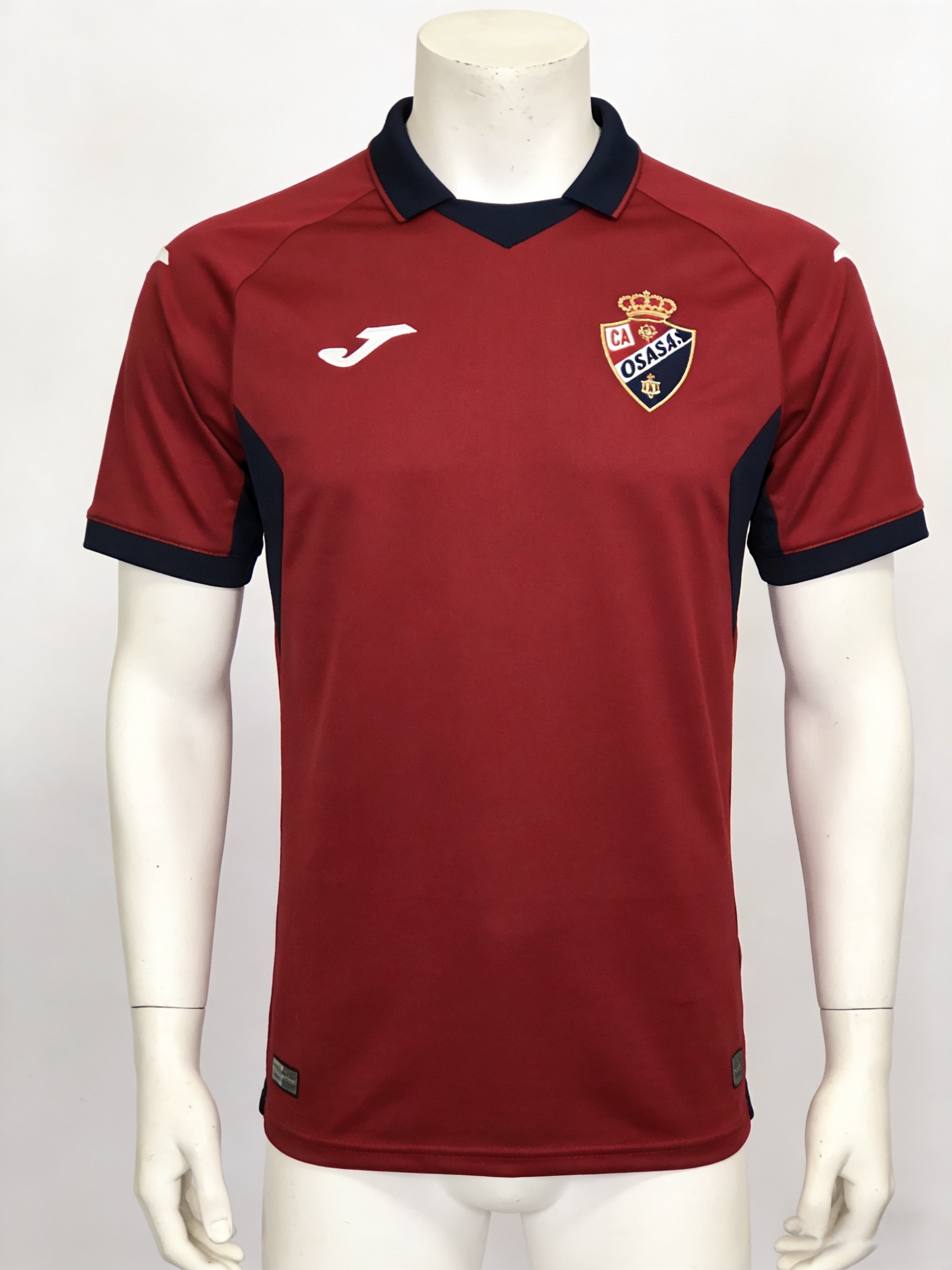 Official 2025-26 CA Osasuna home soccer jersey on display.