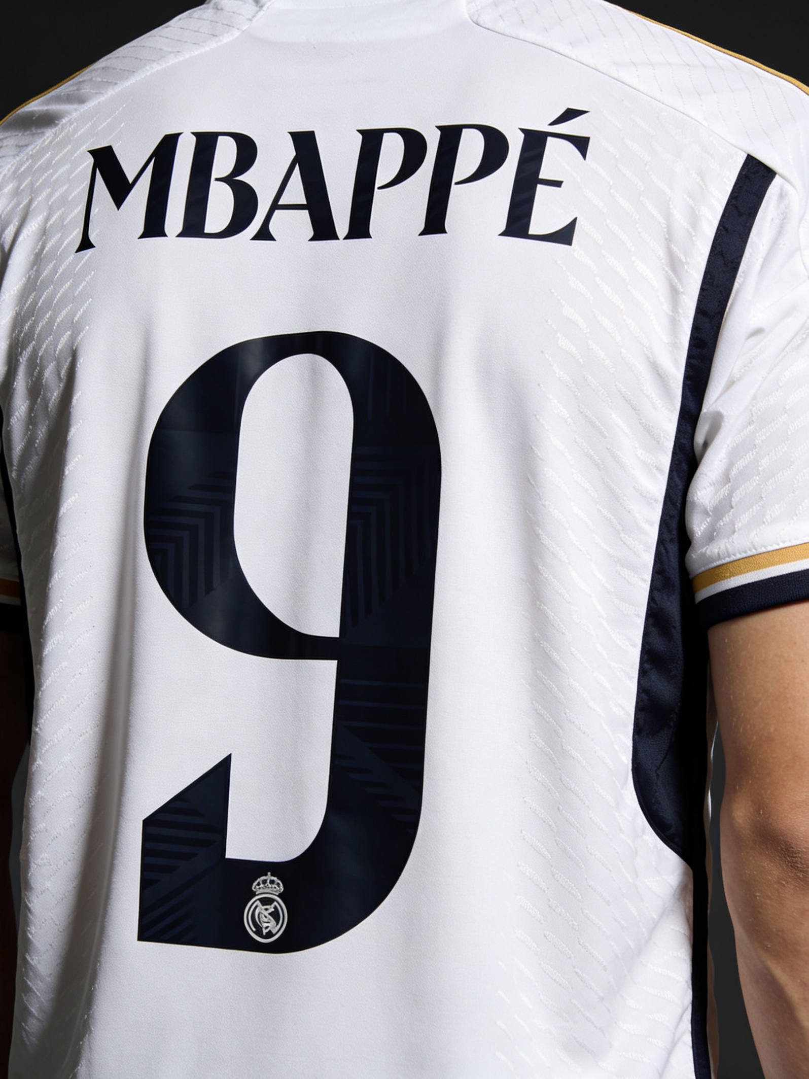 Detail of Mbappe name and number on the Real Madrid 2025 jersey.