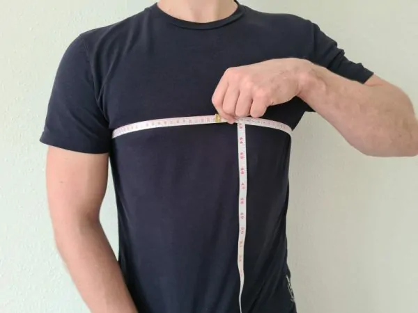 Measuring a Netherlands soccer jersey in inches for a perfect fit.