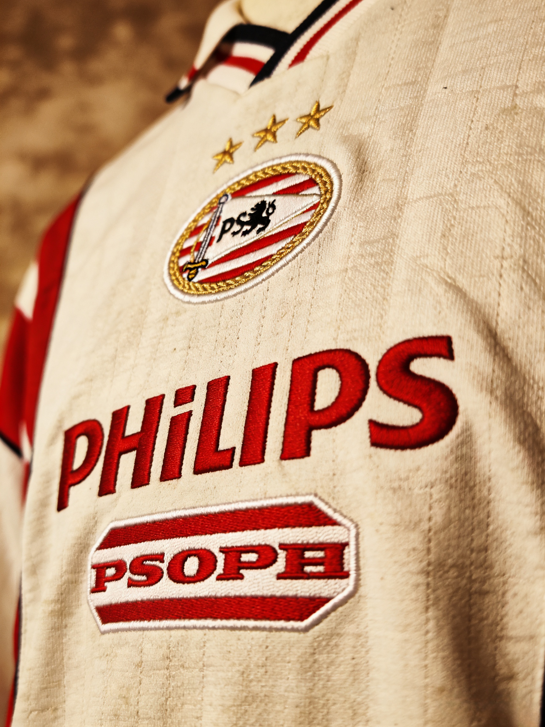 Close-up detail of a vintage PSV Eindhoven Philips retro jersey.