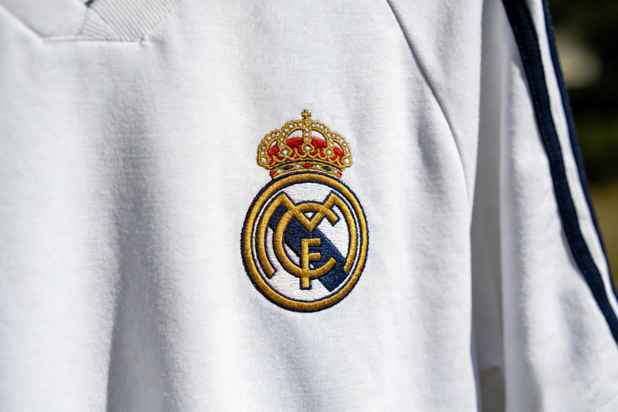 Close-up of the Real Madrid 2002 centenary retro soccer jersey crest