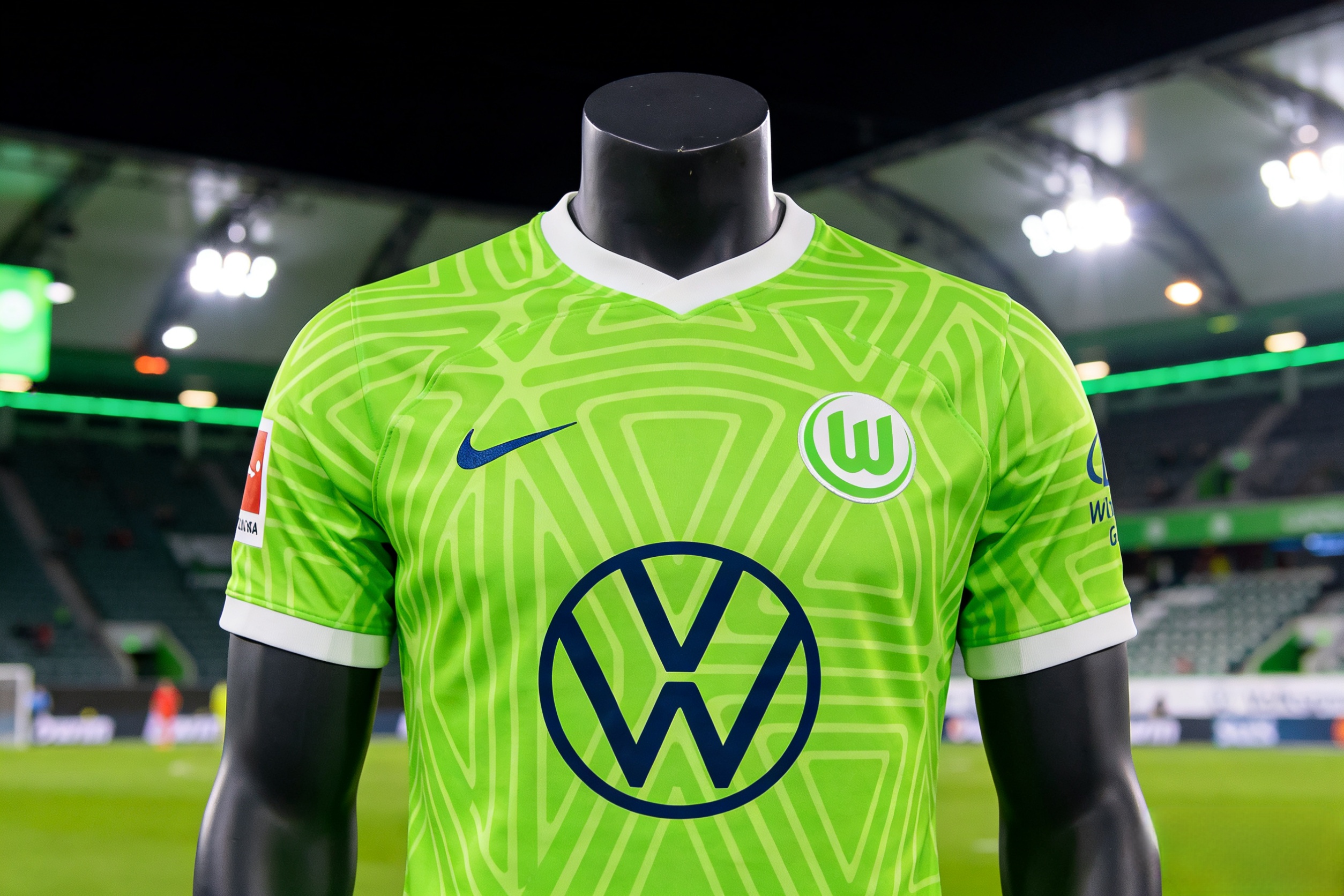 2025-26 VfL Wolfsburg home soccer jersey on display.