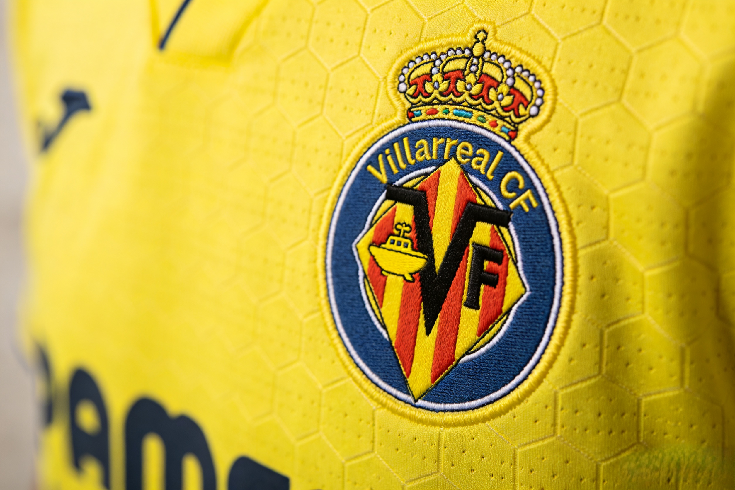 Close-up of the Villarreal CF crest and Dri-FIT fabric